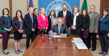 signing photo of plastic packaging stewardship study bill, May 21, 2019