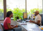 Provider and client talking at a desk