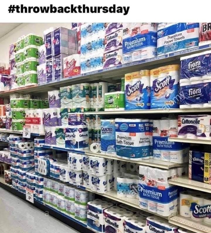 Grocery aisle stocked with tp