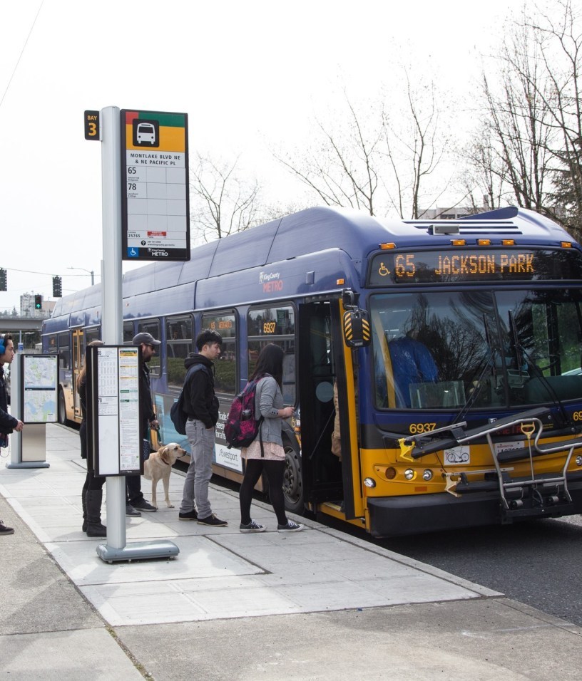 people boarding bus