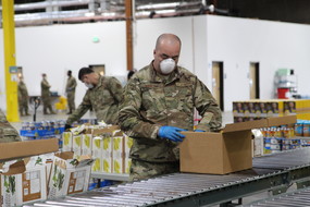 National Guard member packing food