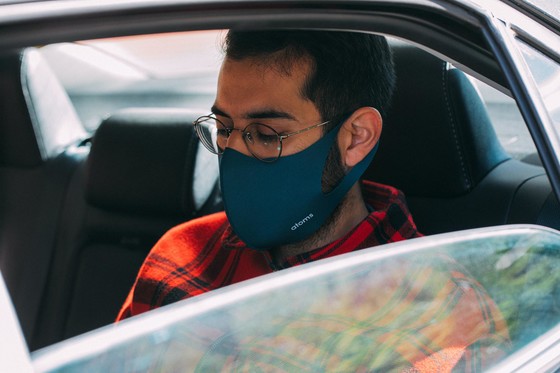 guy in car wearing mask