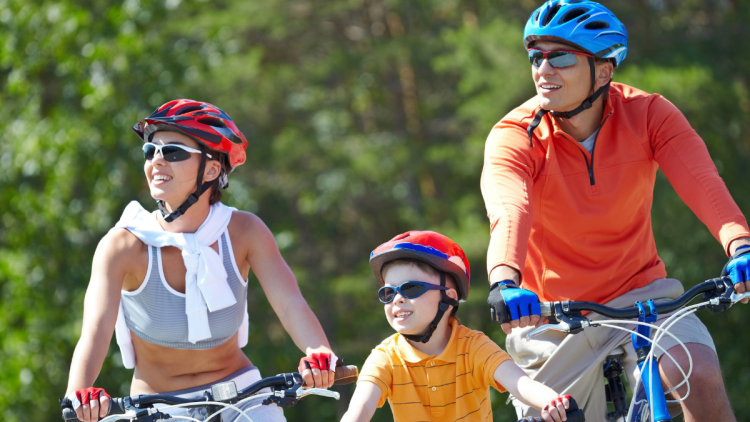 family in bike helmets - PH
