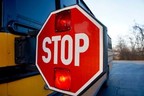 School bus with stop paddle extended and flashing