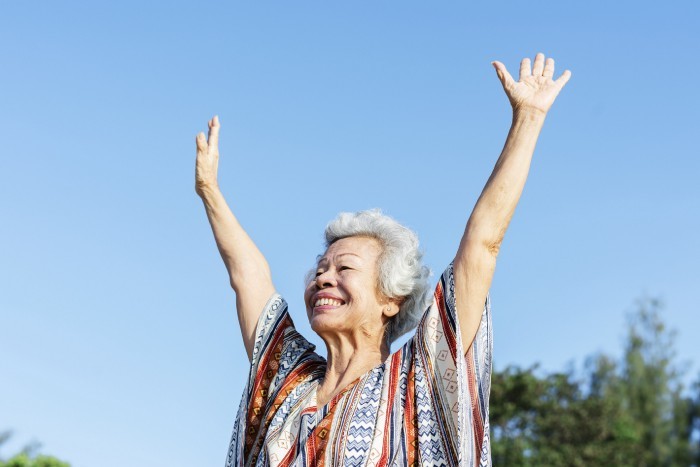 older woman arms up