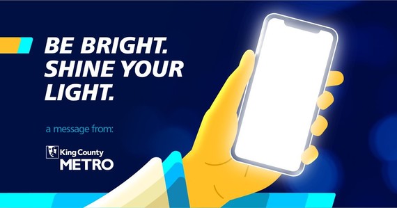 An info graphic with a yellow hand holding a bright smartphone with the text " Be Bright. Shine your light." and King County Metro's logo
