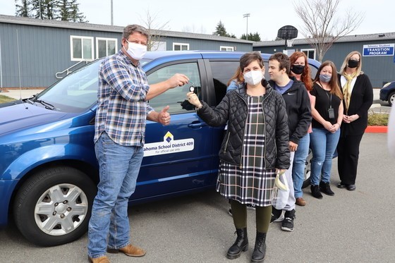 Dunn hands off keys to a donated Metro van