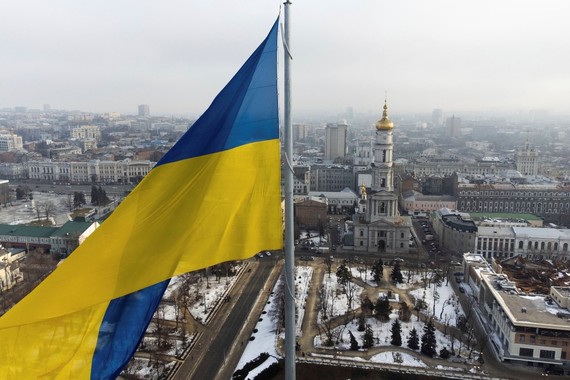 The flag of Ukraine waves over a city