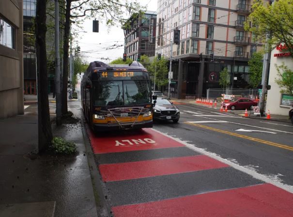 Picture of Route44 bus driving on new red BAT lane in U District