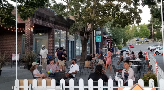 Outdoor seating at a restaurant sidewalk