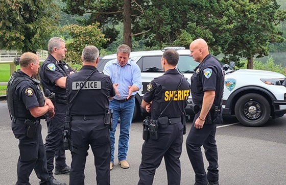 Dunn speaks with local police officers