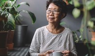 older woman with coffee mug