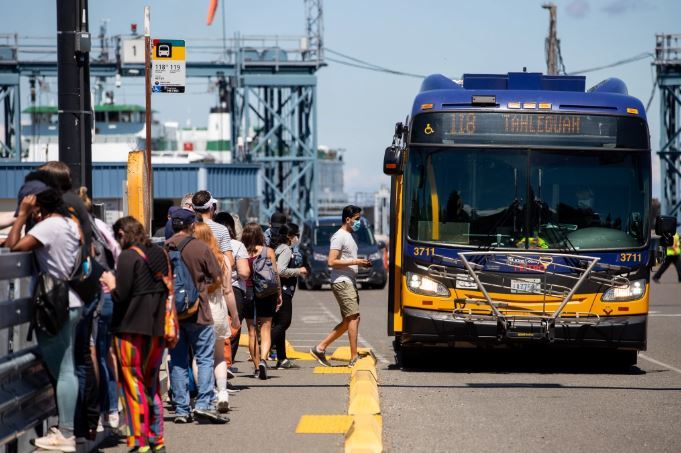 People board the 118 route to the 2021 Strawberry Festival on Vashon Island.