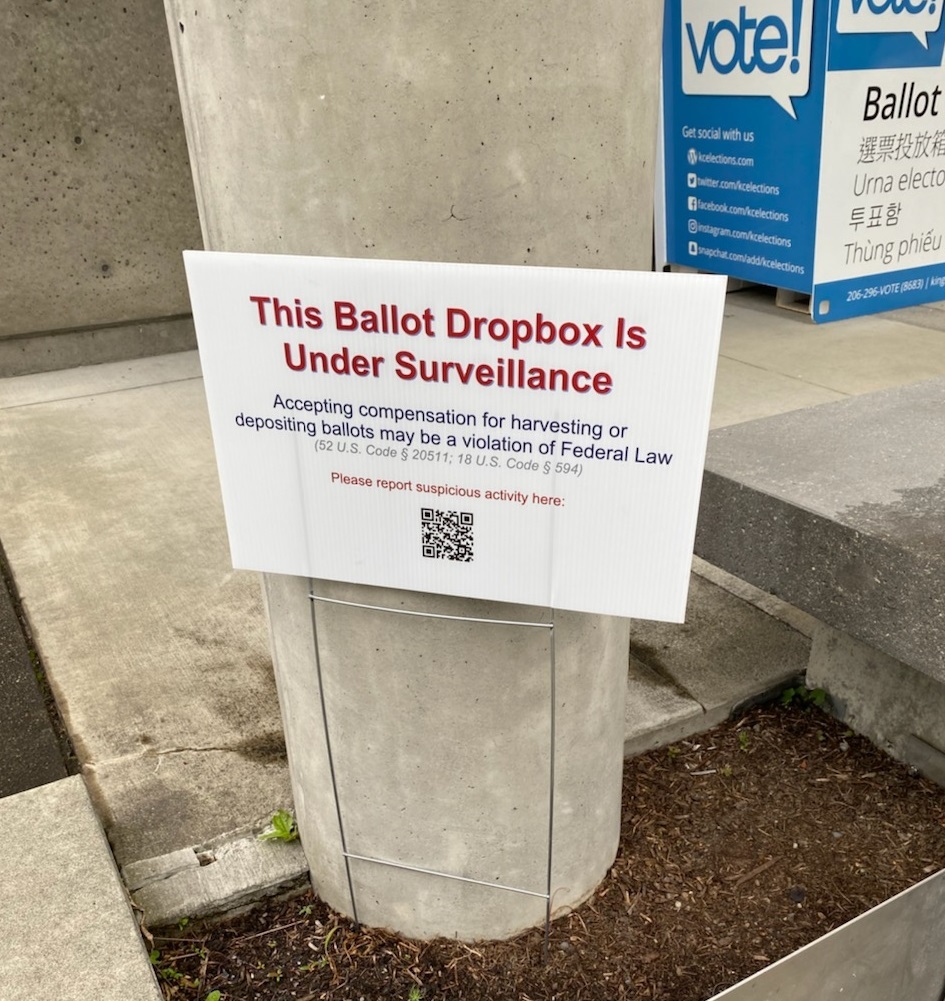 signs appear to be a targeted effort to intimidate and dissuade voters from using secure ballot drop boxes. 