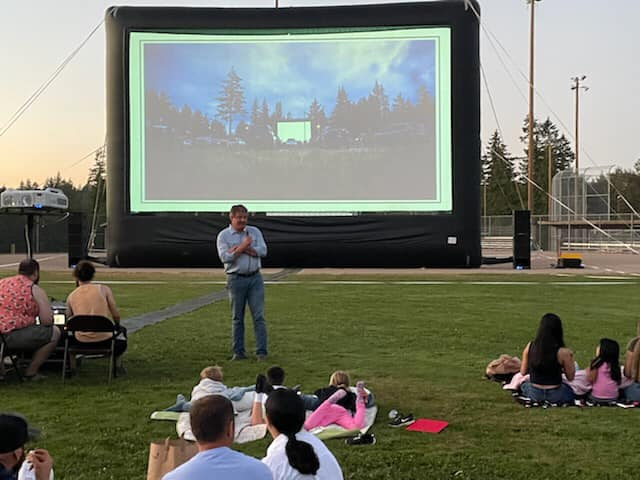 CM Dunn speaking to movie Night Attendees