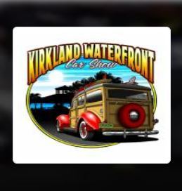Kirkland Waterfront Car Show logo includes white background and back end of classic car with wood paneling and red fenders