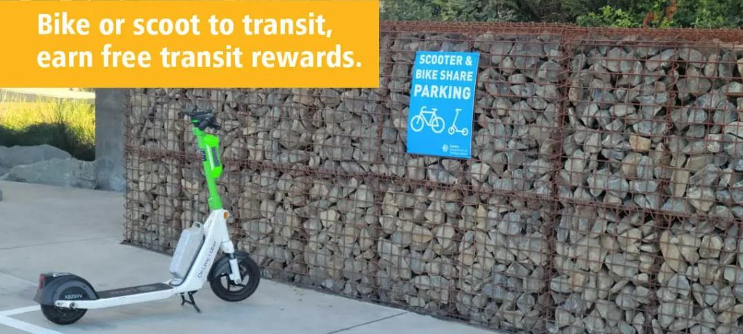 Picture of scooter on sidewalk, text reads, "Bike or scoot to transit, earn free transit rewards"