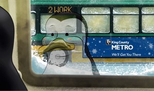 Cartoon image of Perry the Penguin looking through his reflection in a window at Metro coach passing in snow