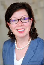 Carina smiles at the camera