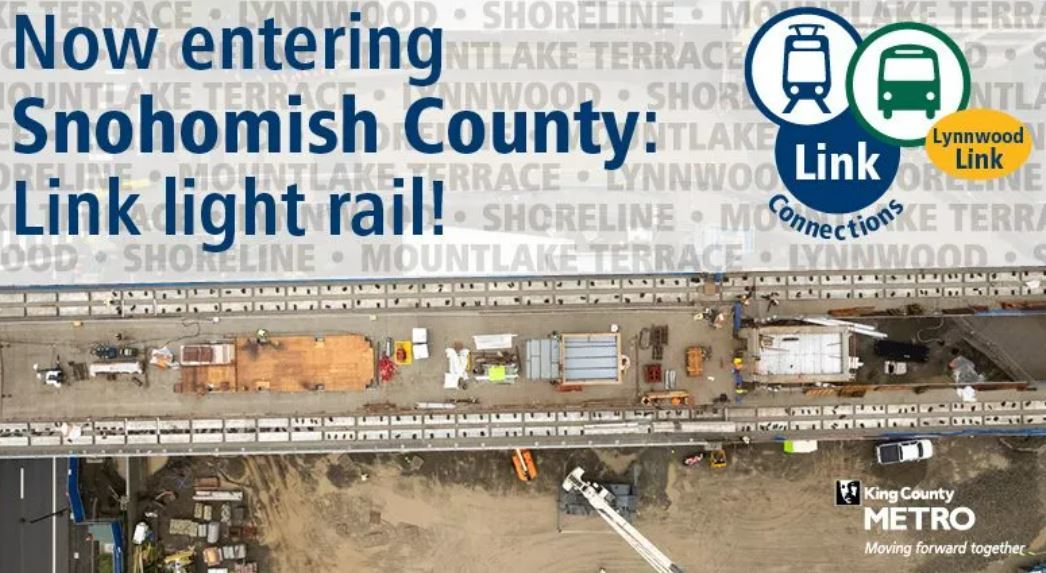 Overhead view of light rail construction. Text reads, "Now entering Snohomish County: LInk light rail!"