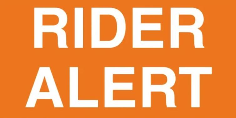 bright orange background and white text that says Rider Alert