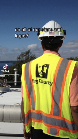 TikTok screenshot of WTD employee looking over a roof at a Wastewater Treatment Plant. 