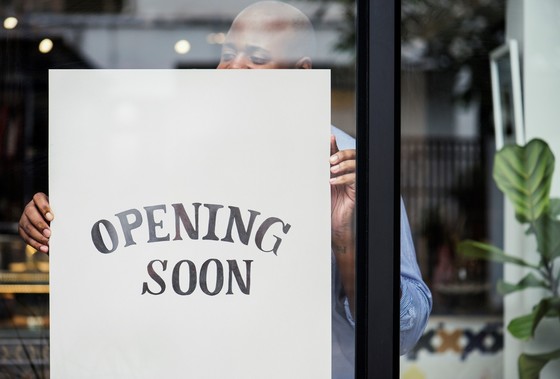 Photo of a small business with an "Opening Soon" sign 