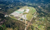 aerial shot of Cedar Hills Regional Landfill with surrounding trees, roads and homes