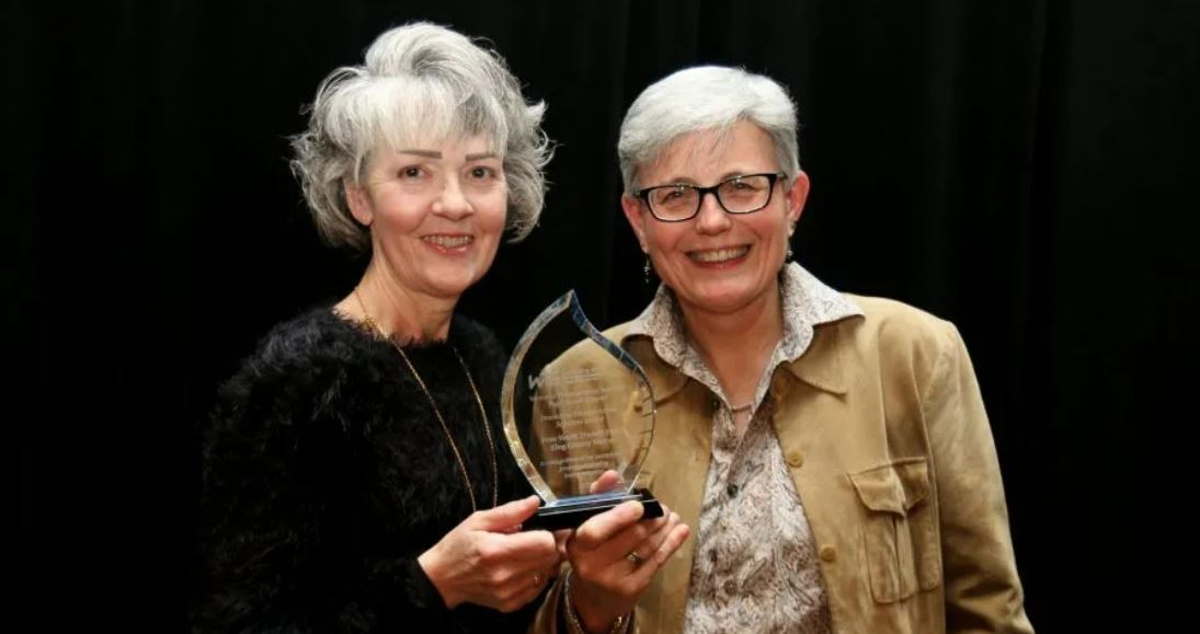 Jeanne Suleiman (l) and Ina Percival with the Innovative Transportation Solution award presented by WTS Puget Sound 