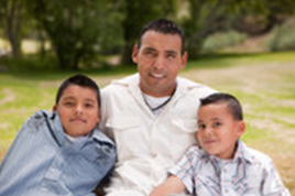 A photo of a father with his two sons