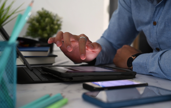 Person's hand using tablet device