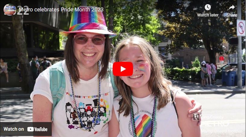 You tube video player with title "Metro celebrates Pride Month 2023" with two women in pride merch and rainbows 