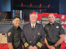 Lee Lim and Austin Peterson with chief Thomas