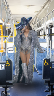 Edited photo of Beyonce in costume inside a Metro Bus