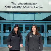 two women stand in front of the WKCAC