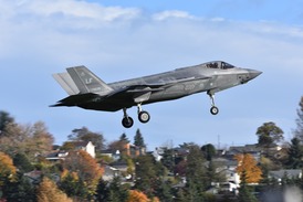 F35 with trees and houses in background