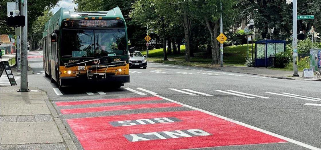 Photo of in service Route 7 bus traveling down Bus Only lane on Rainer Ave