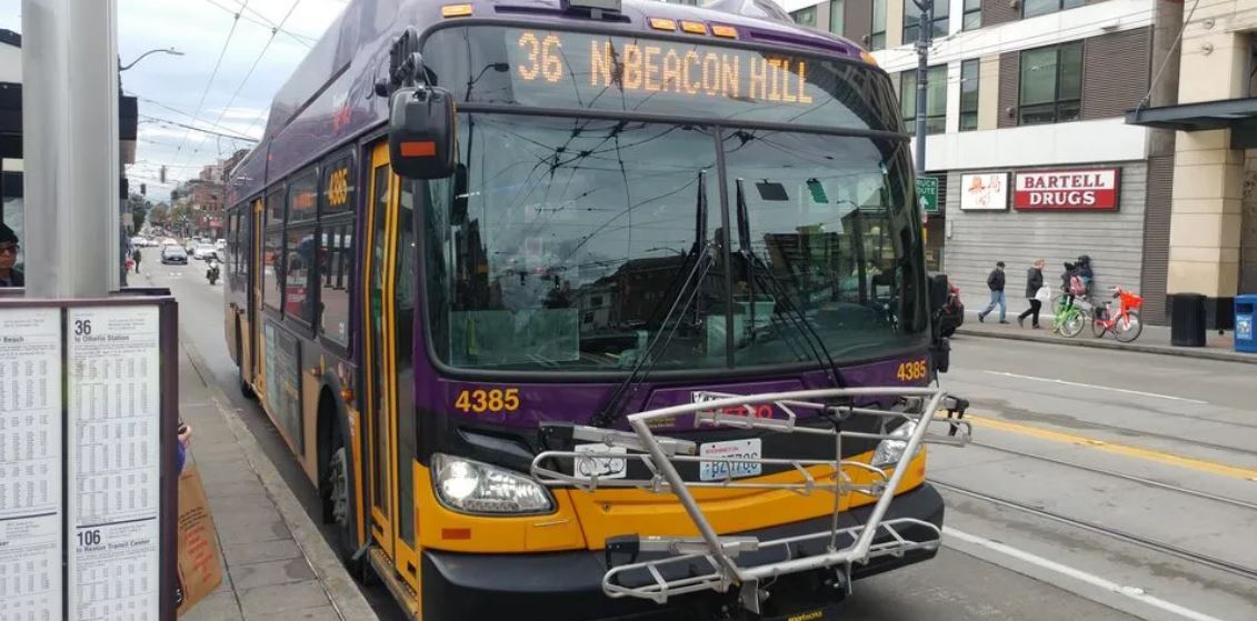 Photo shows close up, front view of Route 36 in service at bus zone.