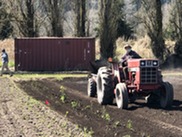 Small King County farmer using a tractor