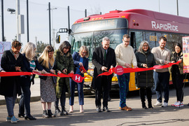 Executive Constantine and community leaders cut a red ribbon to celebrate the launch of the RapidRide H Line.  