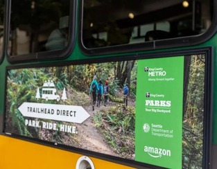 Photo of Trailhead Direct Advertisement on the side of a Metro bus