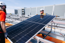 Solar panels being installed on a rooftop at West Point Treatment Plant 