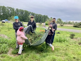 youth carrying tarp