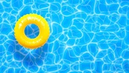 Looking down on an inflatable ring in a pool.