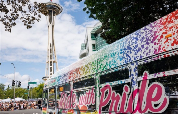 Photo of Metro's Ride with Pride bus parked in front of Seattle Space Needle