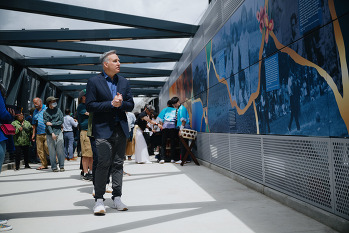 King County Executive Dow Constantine views large art and poetry installations that honor the Japanese-American history of the location