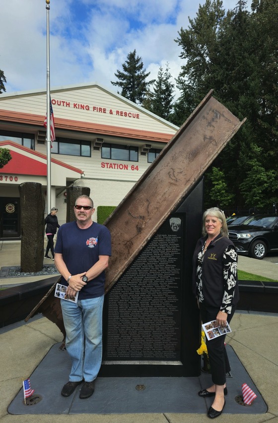 Retired firefighter Sven Schievink and Councilmember Balducci in front of the South King Fire 9/11 Memorial