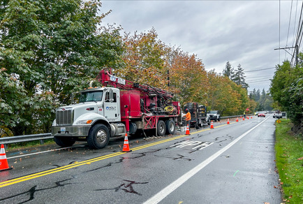 Crews work along East Lake Sammamish Parkway Northeast to install groundwater monitoring wells 