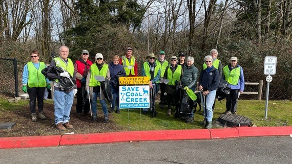 A group of volunteers with a "Save Coal Creek" sign