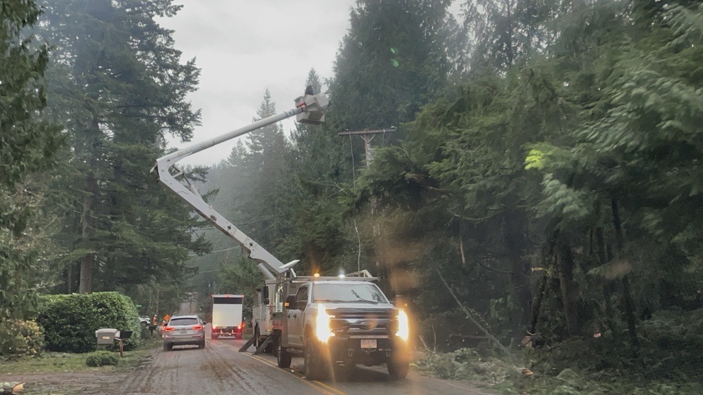 Repair team works in Mirrormont after the storm